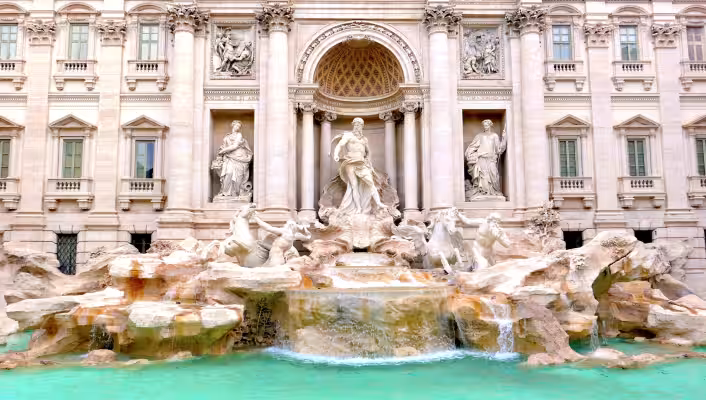 Trevi Fountain in Rome with Oceanus, sea horses, and turquoise water
